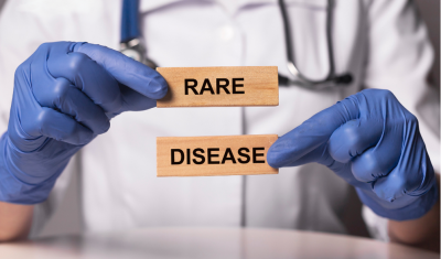 Doctor holding rare disease sign
