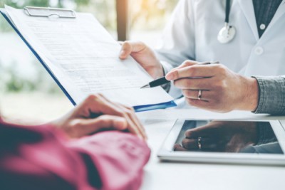 doctor with clip board