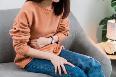 Woman Holding Stomach